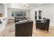 Living room with hardwood floors and a large window overlooking a wooded area at 2751 Margaret Mitchell Nw Dr, Atlanta, GA 30327