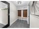 Mudroom with gray tile floor, a custom built-in bench, and storage at 2751 Margaret Mitchell Nw Dr, Atlanta, GA 30327