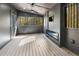 Enclosed porch with ceiling fan and wooded views at 2751 Margaret Mitchell Nw Dr, Atlanta, GA 30327