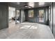 Bright sunroom with neutral tiling, windows to the yard, and sliding glass doors to the interior at 2751 Margaret Mitchell Nw Dr, Atlanta, GA 30327
