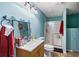 Bathroom with a shower and vanity with a unique mirror at 935 Sunset Ridge Ln, Lawrenceville, GA 30045