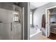 Bathroom featuring a walk-in shower, separate tub, and gray walls at 935 Sunset Ridge Ln, Lawrenceville, GA 30045