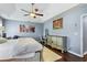 Bedroom showcasing hardwood floors, a ceiling fan, and light blue walls at 935 Sunset Ridge Ln, Lawrenceville, GA 30045
