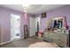 Cozy bedroom with purple walls and a view of the closet space at 935 Sunset Ridge Ln, Lawrenceville, GA 30045