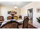 Traditional dining room boasts patterned chairs, a decorative table, and elegant lighting at 935 Sunset Ridge Ln, Lawrenceville, GA 30045