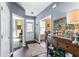 Hallway featuring wood floors, neutral wall color, and access to multiple rooms at 935 Sunset Ridge Ln, Lawrenceville, GA 30045