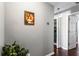 Hallway with wood floors that leads to a laundry room, storage closet and additional room at 935 Sunset Ridge Ln, Lawrenceville, GA 30045