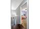Hallway with hardwood floors leading to a bedroom with purple walls and a beanbag at 935 Sunset Ridge Ln, Lawrenceville, GA 30045