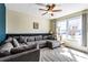 Bright living room with large windows, plush seating, and a cozy atmosphere for relaxation at 935 Sunset Ridge Ln, Lawrenceville, GA 30045