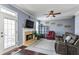 Comfortable living room featuring a fireplace, neutral color scheme, and plenty of natural light at 935 Sunset Ridge Ln, Lawrenceville, GA 30045