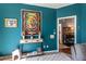 Sitting room with a colorful painting, hardwood floors, and views into other rooms at 935 Sunset Ridge Ln, Lawrenceville, GA 30045