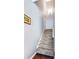 Carpeted staircase with neutral walls, leading to the upper level of the home at 935 Sunset Ridge Ln, Lawrenceville, GA 30045
