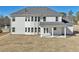 Back of the home featuring a covered patio and a spacious, unfinished yard at 1451 Stephens View Dr, Loganville, GA 30052