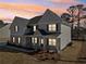A beautifully designed two-story home with a mix of siding and brick exterior at 1451 Stephens View Dr, Loganville, GA 30052