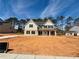 New construction two-story home featuring large front yard with sod in process at 1451 Stephens View Dr, Loganville, GA 30052