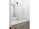 Stylish powder room featuring a modern vanity with elegant gold fixtures and a large mirror at 245 Mayfair Ct, Alpharetta, GA 30009