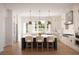 Bright kitchen featuring a center island with seating, stainless steel appliances, and white cabinets at 245 Mayfair Ct, Alpharetta, GA 30009
