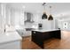Bright kitchen features an island, stainless steel appliances, and access to the outside at 245 Mayfair Ct, Alpharetta, GA 30009