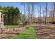 Large backyard featuring a grassy path and a play structure for  at 5640 Copper Creek Pass, Cumming, GA 30040