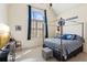Bedroom with a four-poster bed, a large window with curtains, and unique decor at 5640 Copper Creek Pass, Cumming, GA 30040