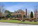 Charming community clubhouse with covered front porch and landscaped grounds at 5640 Copper Creek Pass, Cumming, GA 30040