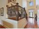 Elegant foyer showcasing hardwood floors, grand staircase, and soaring ceilings at 5640 Copper Creek Pass, Cumming, GA 30040