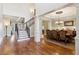Spacious home featuring stairs, hardwood floors, dining room, and an open floor plan at 5640 Copper Creek Pass, Cumming, GA 30040
