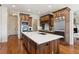 Kitchen with island, modern appliances, and custom cabinets at 5640 Copper Creek Pass, Cumming, GA 30040