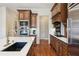 Modern kitchen with stainless steel appliances and custom cabinetry at 5640 Copper Creek Pass, Cumming, GA 30040