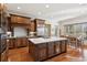 Gourmet kitchen featuring a spacious island, stainless steel appliances, and eat-in dining area at 5640 Copper Creek Pass, Cumming, GA 30040