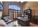 Home office featuring a large window with natural light and built-in shelving at 5640 Copper Creek Pass, Cumming, GA 30040