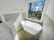 Modern bathroom features a soaking tub and a scenic view at 6719 Winterberry Ridge Dr, Stone Mountain, GA 30087