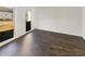 Cozy bedroom with hardwood floors and a large window at 6719 Winterberry Ridge Dr, Stone Mountain, GA 30087