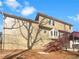 Exterior view of home showing stairs, deck, walkout basement, and wooded lot at 6719 Winterberry Ridge Dr, Stone Mountain, GA 30087