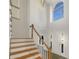 Bright foyer with high ceilings and wooden stairs at 6719 Winterberry Ridge Dr, Stone Mountain, GA 30087