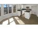 Open-concept kitchen with white cabinets, granite counters, stainless steel appliances, and a breakfast nook at 6719 Winterberry Ridge Dr, Stone Mountain, GA 30087