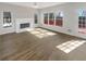 Features a fireplace, ceiling fan, and access to an outdoor deck at 6719 Winterberry Ridge Dr, Stone Mountain, GA 30087