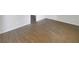 Open living room featuring wood-look floors and neutral walls at 6719 Winterberry Ridge Dr, Stone Mountain, GA 30087