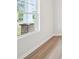Bright room featuring hardwood floors and a window offering natural light at 1452 Stephens View Dr, Loganville, GA 30052