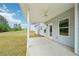 Relax on this charming covered patio, offering a seamless transition to the large, grassy backyard at 1452 Stephens View Dr, Loganville, GA 30052