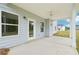 An inviting covered patio features a ceiling fan and overlooks a spacious backyard, perfect for outdoor entertaining at 1452 Stephens View Dr, Loganville, GA 30052