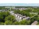 An aerial view of the building at 321 Dilbeck Road, surrounded by lush greenery and city views at 321 Dilbeck Ne Cir, Atlanta, GA 30342