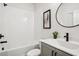 Modern bathroom with white subway tile, matte black fixtures, and a stylish round mirror at 321 Dilbeck Ne Cir, Atlanta, GA 30342