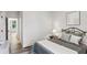 Cozy bedroom with neutral tones, soft textures, and a comfortable bed adorned with pillows and a decorative throw at 321 Dilbeck Ne Cir, Atlanta, GA 30342