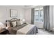 Cozy bedroom with neutral tones, a large window, and soft textures creating a relaxing space at 321 Dilbeck Ne Cir, Atlanta, GA 30342