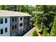 Modern townhome complex at 321 Dilbeck featuring neutral exteriors, private driveways, and ample greenery at 321 Dilbeck Ne Cir, Atlanta, GA 30342