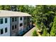 Modern townhome complex featuring neutral exteriors, private driveways, and ample greenery at 321 Dilbeck Ne Cir, Atlanta, GA 30342