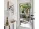 Bright foyer with view to backyard, marble table, artwork, and hardwood floors at 321 Dilbeck Ne Cir, Atlanta, GA 30342