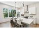 Bright kitchen with island, stainless steel appliances, and oversized view-through window at 321 Dilbeck Ne Cir, Atlanta, GA 30342