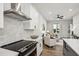 Kitchen with stainless steel appliances and hardwood floors with open view to living room at 321 Dilbeck Ne Cir, Atlanta, GA 30342